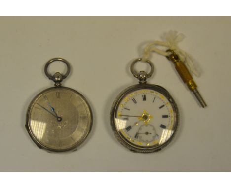 A small silver open face pocket watch, engine turned dial, Roman numerals; another, small silver open face pocket watch, engi