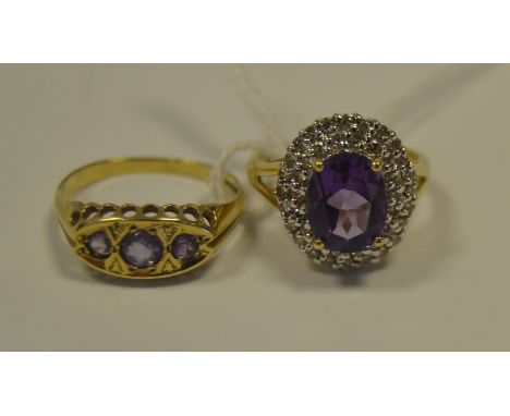 An amethyst and diamond chip ring, 9ct gold shank;  another, three stone, 9ct gold shank, 5.9g gross