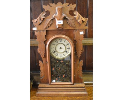An American Ansonia-style clock, enamel dial, Roman numerals
