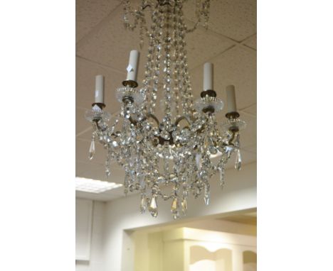 A French  crystal chandelier, six scroll arms,  with prismatic droppers and swags, 77cm high, c.1870
