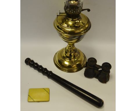 An early 20th century brass oil lamp;  a Policeman's truncheon;  a pair of binoculars;    an Art Deco cigarette  case (4)