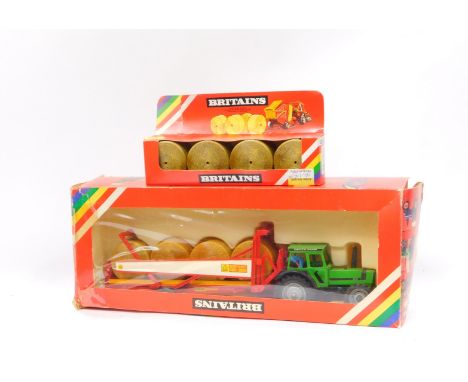 A Britains die cast Dautz-Fahr DX92 tractor with bale transporter,  9602, and a round bales set 1743, boxed.  (2)
