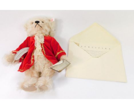 A Steiff musical Mozart plush jointed teddy bear, wearing red jacket, with red label, with paperwork, 26cm high.