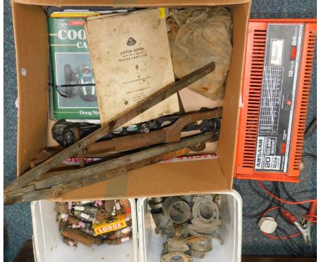 An Absaar battery charger, spark plugs, Atlantic bulb box, tools, Lotus car parts and manuals. (qty)