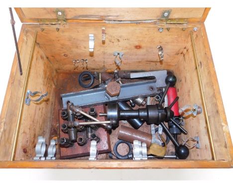 A tool box, containing various drill parts and sundry further tools. 
