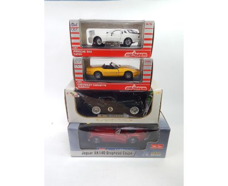 Four die cast sports cars, comprising Sunstar Jaguar XK140 drop head coupe, 1:18 scale.,  Signature Models 1949 Jaguar XK120 