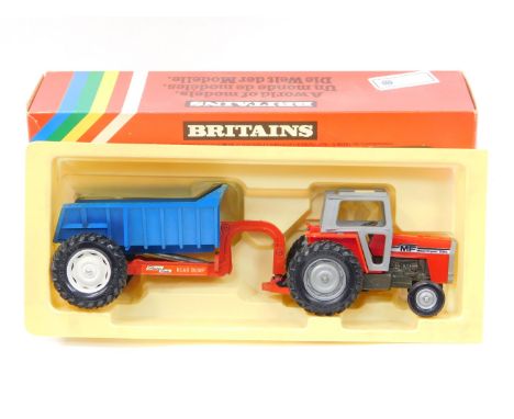 A Britains die cast Massey Ferguson tractor with rear dump trailer, 9587, boxed.