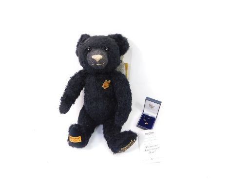 A Merrythought Diamond Anniversary 1930-2005 black plush jointed teddy bear, with label and certificate, 44cm high, with pape