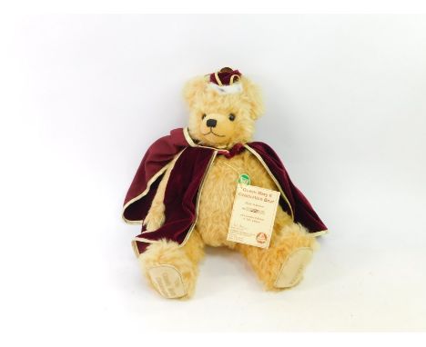 A Hermann Celebration Queen Mary II limited edition plush jointed teddy bear, number 221/950, wearing red cloak, stitched to 