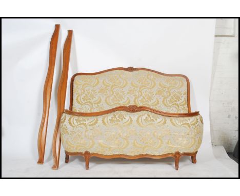 A 20th century French tapestry upholstered beech wood reeded corbeille double bed. The upholstered head and footboards with r