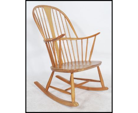 A vintage Ercol beech and elm Windsor rocking chair - armchair in Golden Dawn. Sleigh runners with turned legs, panel seat an