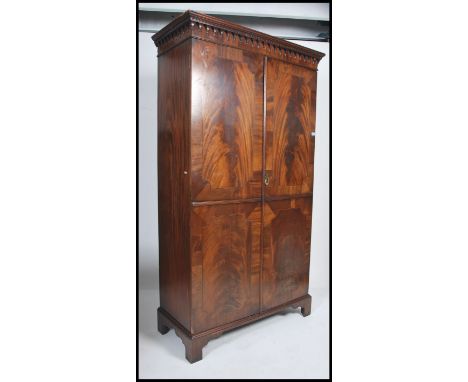 A good 19th century mahogany inlaid bow front wardrobe being raised on bracket feet with twin full length panel doors having 