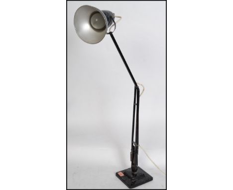 A 1940's Industrial pre-war Herbert Terry anglepoise lamp, raised on a cast metal two step base with pendant shade, finished 