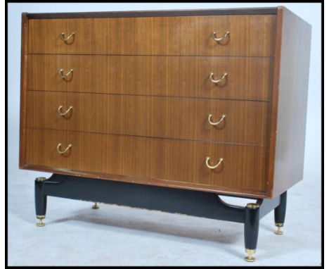 A vintage mid 20th century G Plan Ernst Gomme straight four chest of drawers from the Librenza range with a gold stamp to top