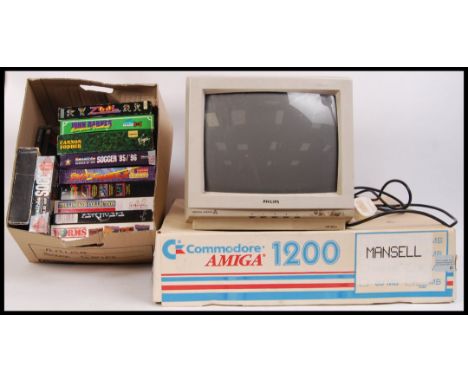 An original retro Commodore Amiga 1200 computer systems together with Philips computer screen & a large collection of games t