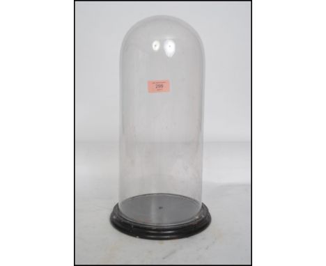 A large / tall Victorian glass dome and ebonised plinth stand being ideal for taxidermy or clock cover ( see illustrations ) 