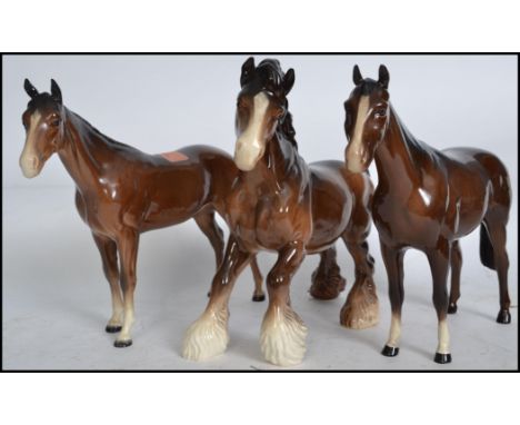 A group of three 20th century Beswick ceramic horses / fowls to include a Beswick Shire horse. Measures: 25cm Long. 