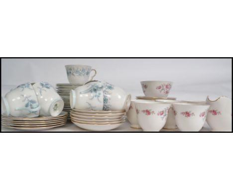 A good group of china ceramic chintzy pattern trios and part tea services to include cups, saucers, side plates. cake plates 