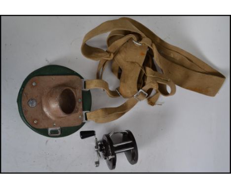 A vintage big game fishing harness by Grice and Young of Christchurch, Hants together with a Penn Reels sea boy star drag fis