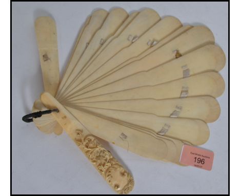 A 19th century ladies fan made of ivory and in the manner of Dieppe. The fan with many blades having rococo carved front and 