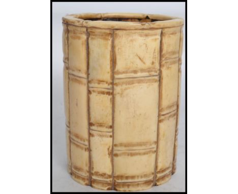 A 19th century Chinese cylindrical brush pot constructed of bone / ivory? and formed in the manner of bamboo. Measures: 13cm 