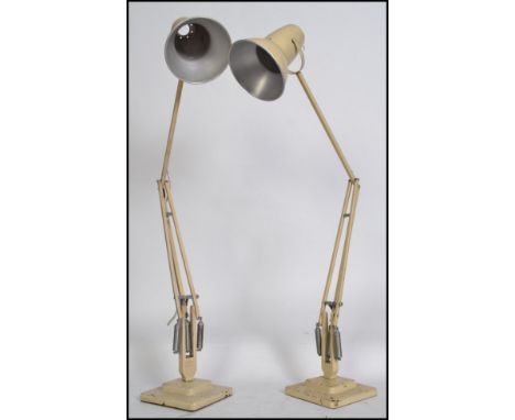 A pair of Herbert Terry mid century anglepoise Industrial desk lamp lights in white having twin step square terraced bases an