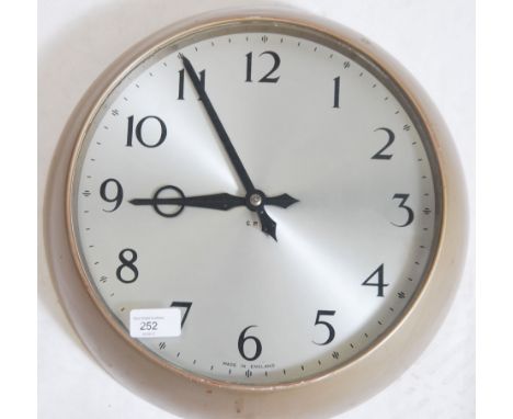 A retro mid century GPO factory / office wall clock with circular dial having baton numerals