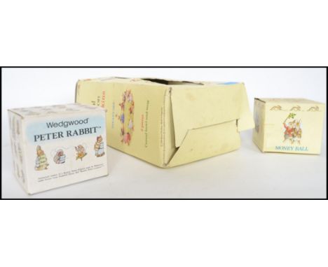 Three boxed Beatrix Potter Bunnykins ceramic figures, two by Royal Doulton and the other by Wedgwood to include money boxes a