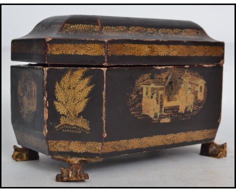 A 19th century Chinese export gilded and lacquered tea caddy of canted rectangular form, the hinged lid opening to reveal a t