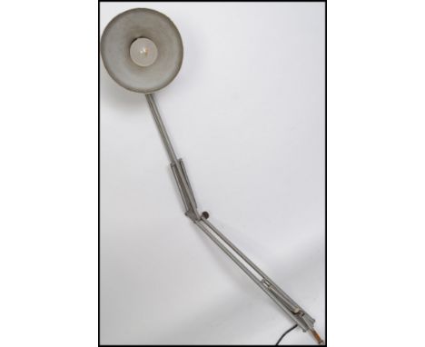 A vintage 20th century retro industrial wall mounted anglepoise lamp having a polished steel finish with pendant shade and wa