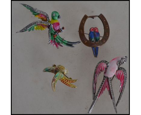 A group of four vintage 20th century costume jewellery brooches in the form of enamel and marcasite birds to include Love Bir