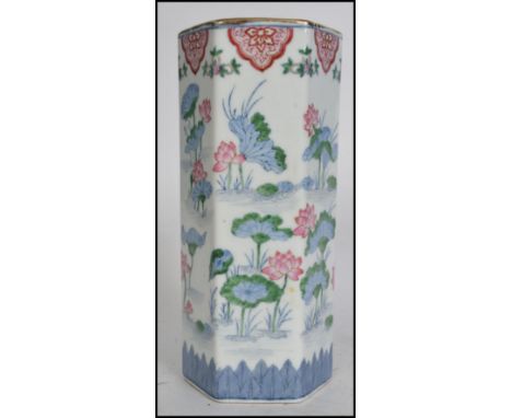 A large Oriental ceramic Large brush pot / vase of hexagonal form having a gilt rim being hand painted with chrysanthemum flo