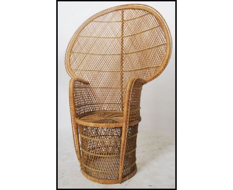 A vintage 20th century / late 1970's retro wicker peacock armchair -chair. Large open back chair with woven seat. 137x92x50cm