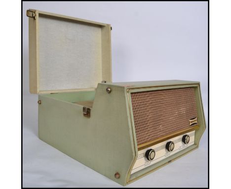 A vintage retro mid 20th century Dansette Conquest Auto four speed record player having a twin dial Monarch deck set in a two