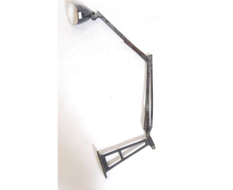 A large early 20th century Industrial wall mounted anglepoise desk / factory lamp having two tone black and white pendant sha