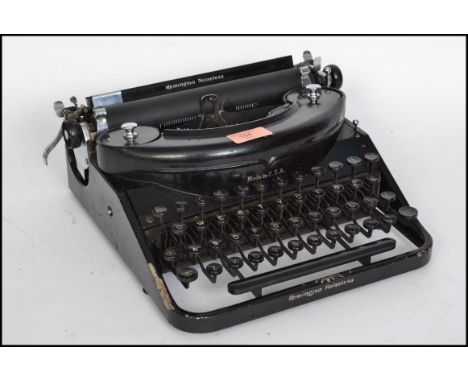 An early 20th century Remington portable Noiseless No. 7 typewriter in original finish with applied notation. 