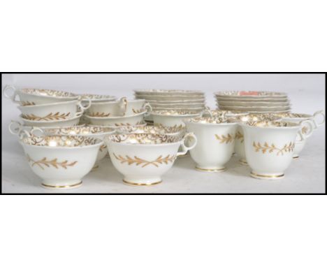 A vintage 20th century bone China tea service decorated with hand applied gilt overlay, consisting of trio's etc please see i