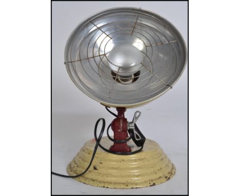 A retro 1950's Bridge & Co beehive style desk lamp being recently converted. The space age style pendant shade over painted b