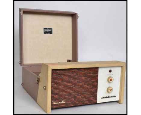 A vintage mid 20th century Dansette Challenge 106 vinyl record player having a 4 speed Monarch deck housed in a two tone case