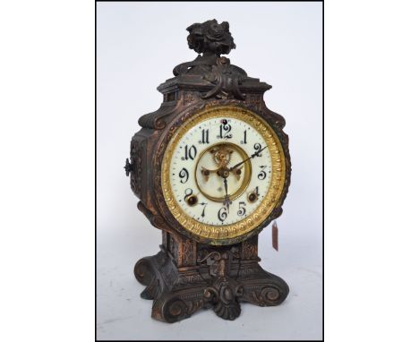 An ornate 19th century cast metal  Ansonia sculptural mantel clock, the movement with revealed escapement 