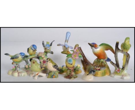 A collection of ceramic  bird figurines to include Goebel, Royal Adderlay please refer to images. Measures: 16cm wide. 