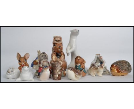 A collection of ceramic animal figures by various makers to include Royal Copenhagen, USSR, Coalport, Wade, Pendelfin etc. Me
