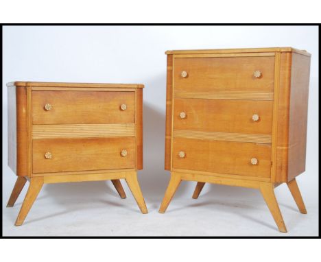 A 1930's Art Deco oak chest of drawers and matching dressing table, each being raised on tapering legs with a series of drawe