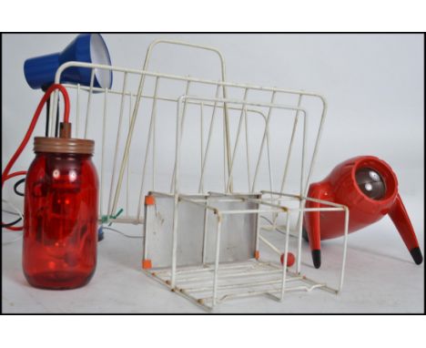 A collection of 5x retro items to include; blue desk lamp, Red spaceship- like projector, Jam Jar light, Pintas milk delivery