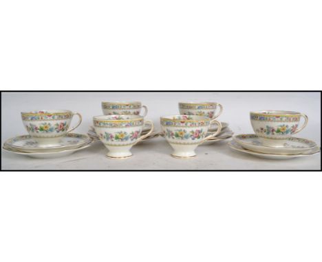 A set of six Foley ceramic china trios in the Ming Rose pattern consisting of cups, saucers and sandwich plates each being st