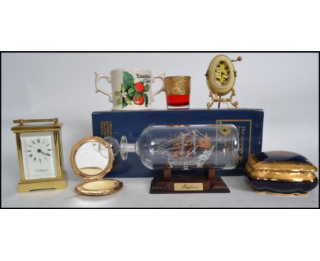 A collection of items to include a boxed ' Mayflower ' ship in a bottle, carriage clock by Wellington, Limoges lidded cobalt 