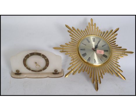 A vintage retro 20th century star burst / sun burst wall clock having faceted hands along with an Art Deco style white onyx m