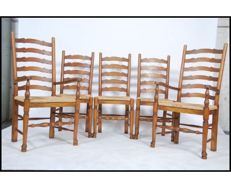 A set of 5 Brights of Nettlebed antique style rattan weave ladderback dining chairs. Each raised on turned legs with rattan s