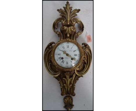 A good19th Century French brass ormulu Cartel Clock by Raing & Frer Paris. The case of flowering scrolled acanthus with an en