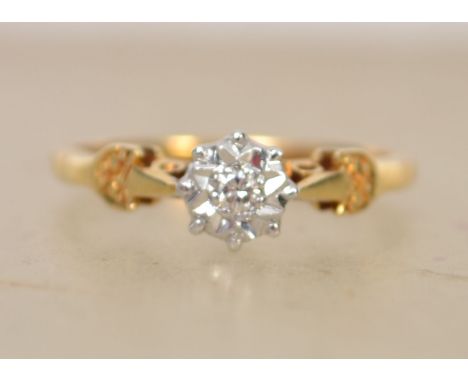 A hallmarked 18ct gold and diamond solitaire ring with illusion star set diamond in a pierced gallery. Hallmarked Birmingham.